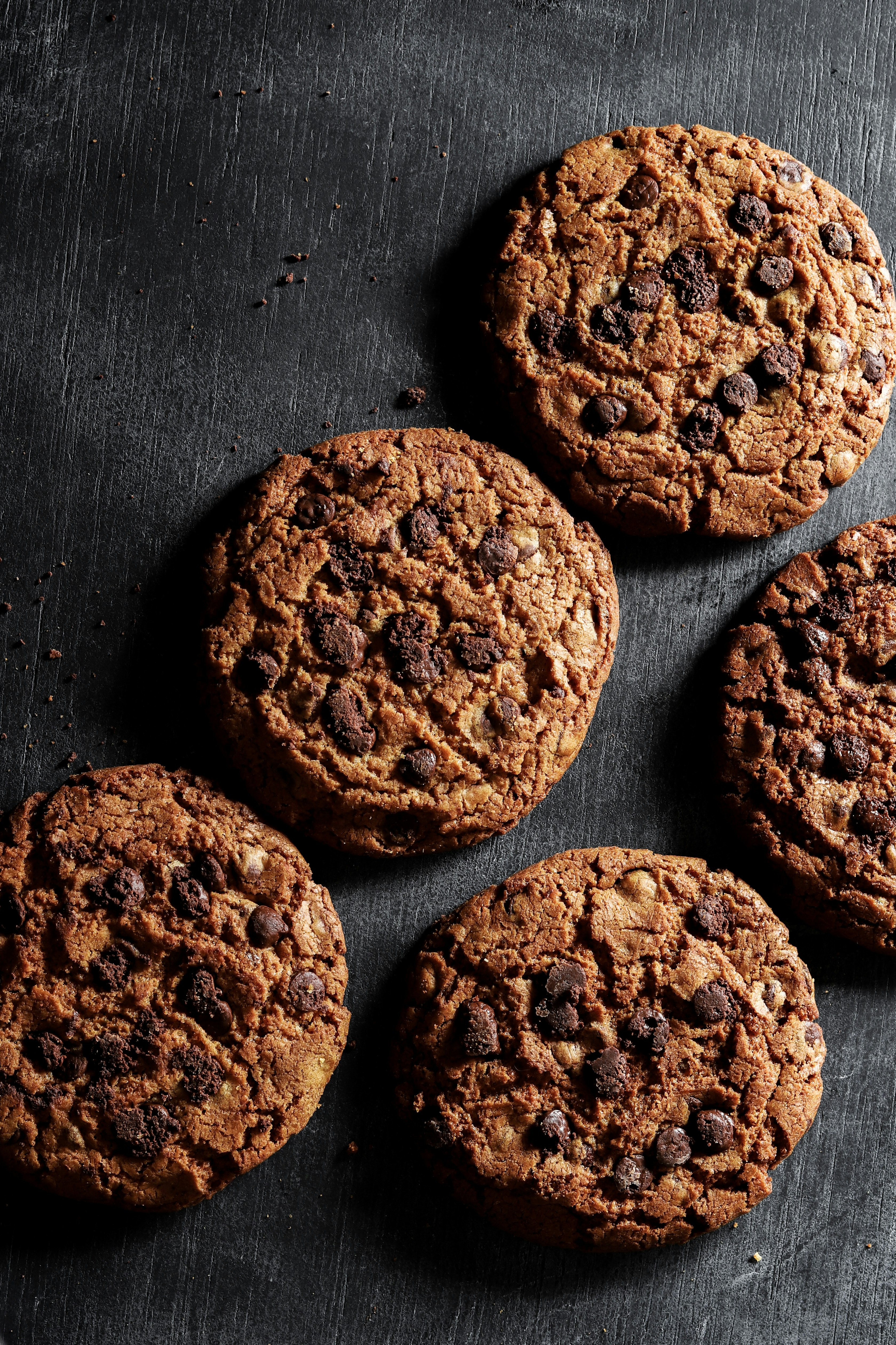 brown cookies on black surface