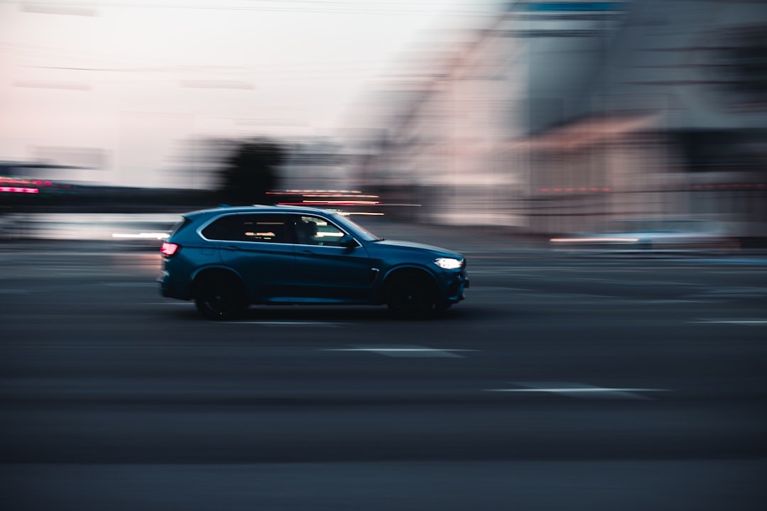 black sedan on road during daytime