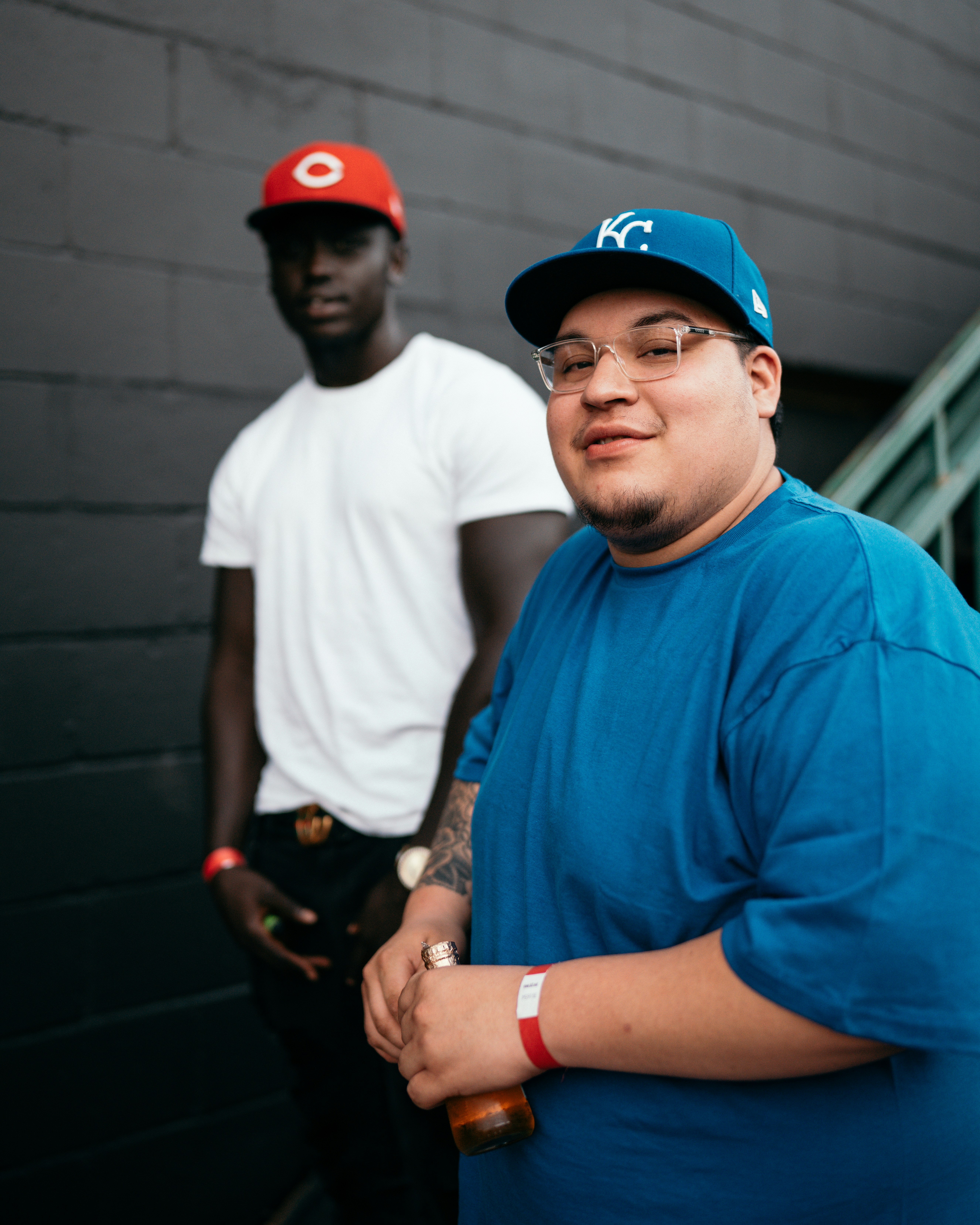 man in blue crew neck t-shirt wearing red cap