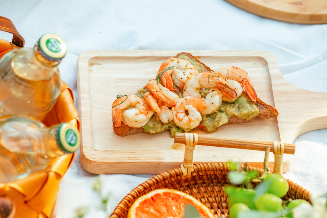 shrimp on brown wooden chopping board