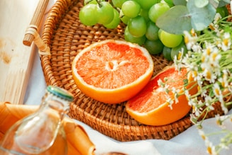 orange fruit on brown woven basket