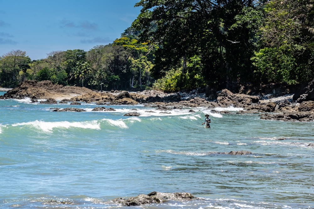 person surfing on sea during daytime