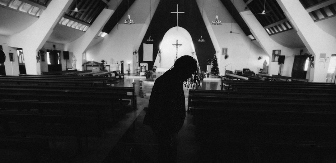 silhouette of person in church