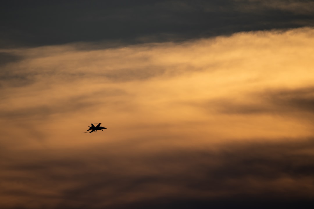 airplane flying in the sky during daytime