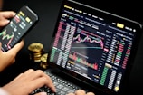person using black tablet computer