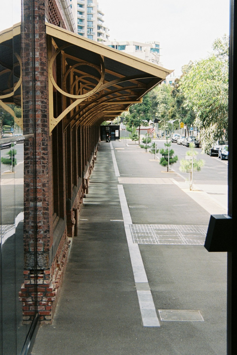 brown wooden bridge over the city during daytime