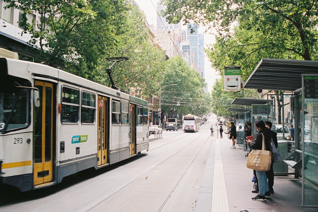 white and blue tram on road during daytime