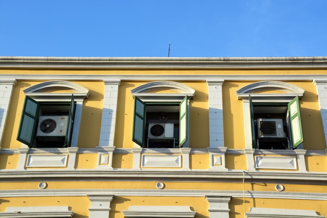 yellow concrete building under blue sky during daytime