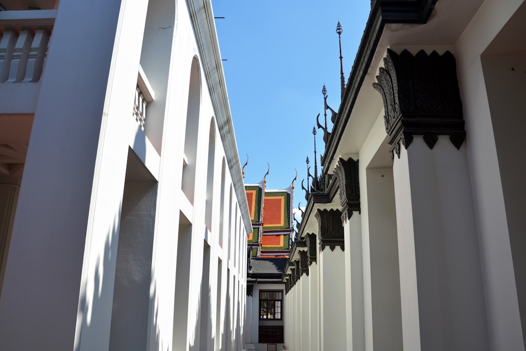 white and brown concrete building under blue sky during daytime