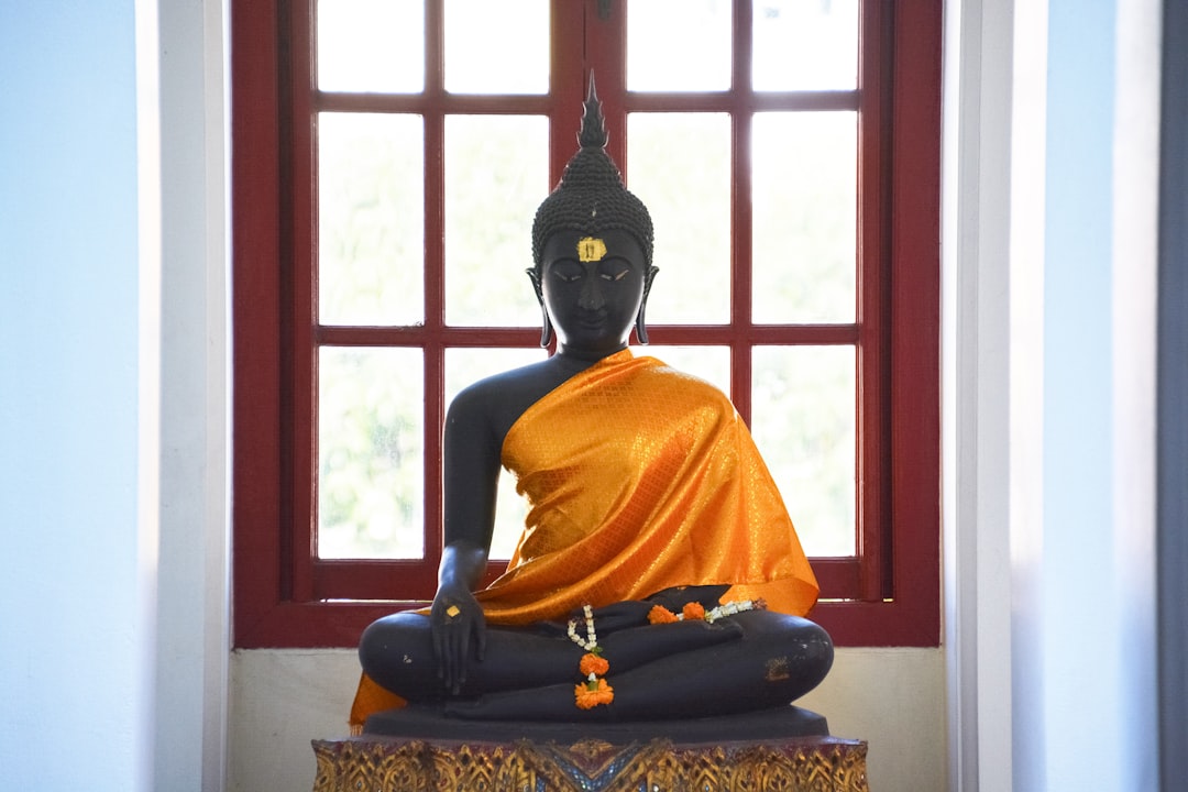 black and gold buddha figurine
