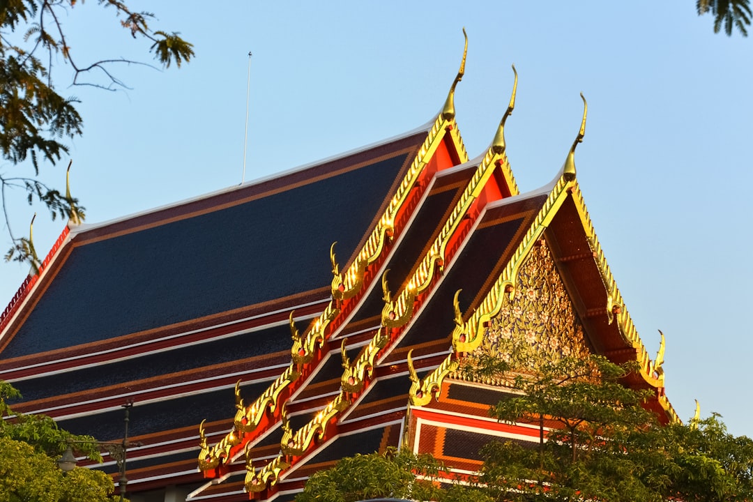 red and gold temple under blue sky during daytime