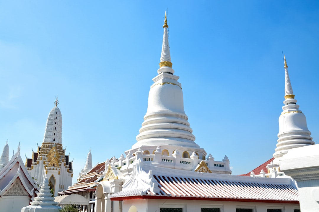 white and gold temple under blue sky during daytime