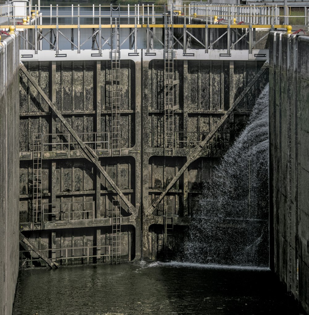 gray concrete bridge over river