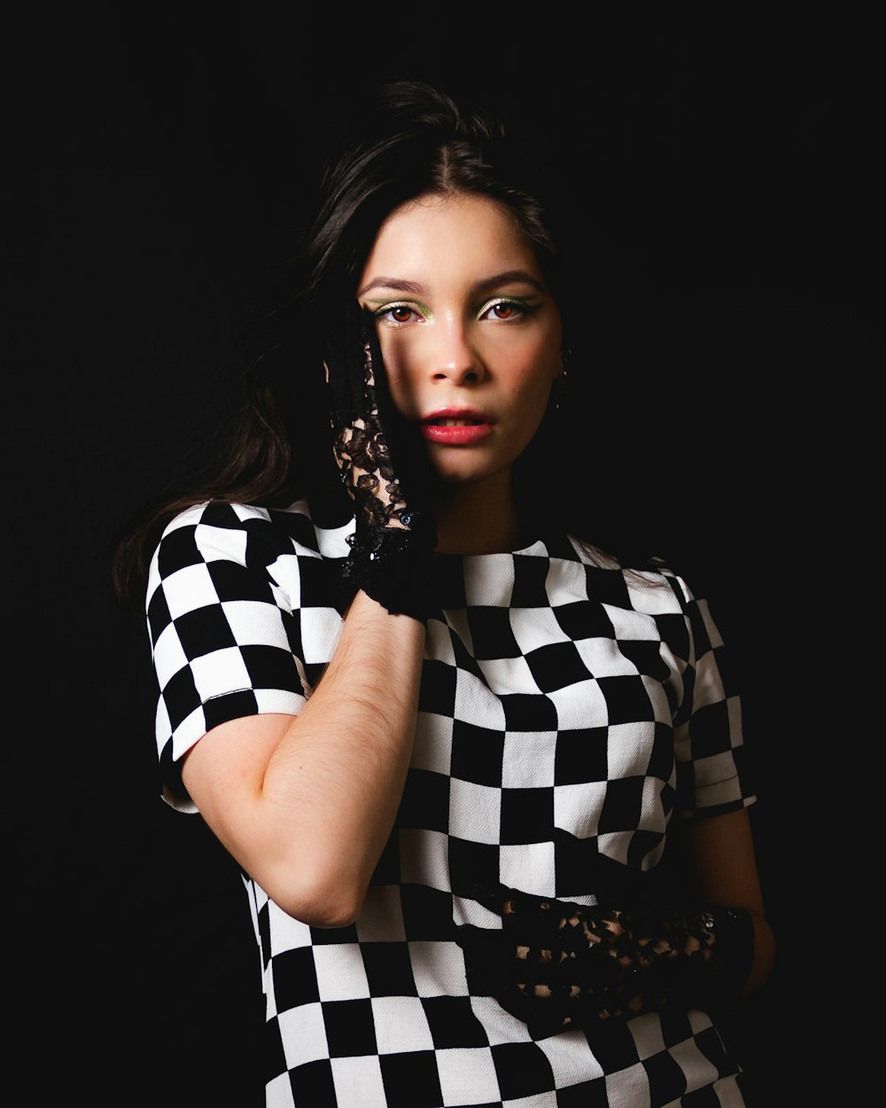 woman in black and white checkered dress