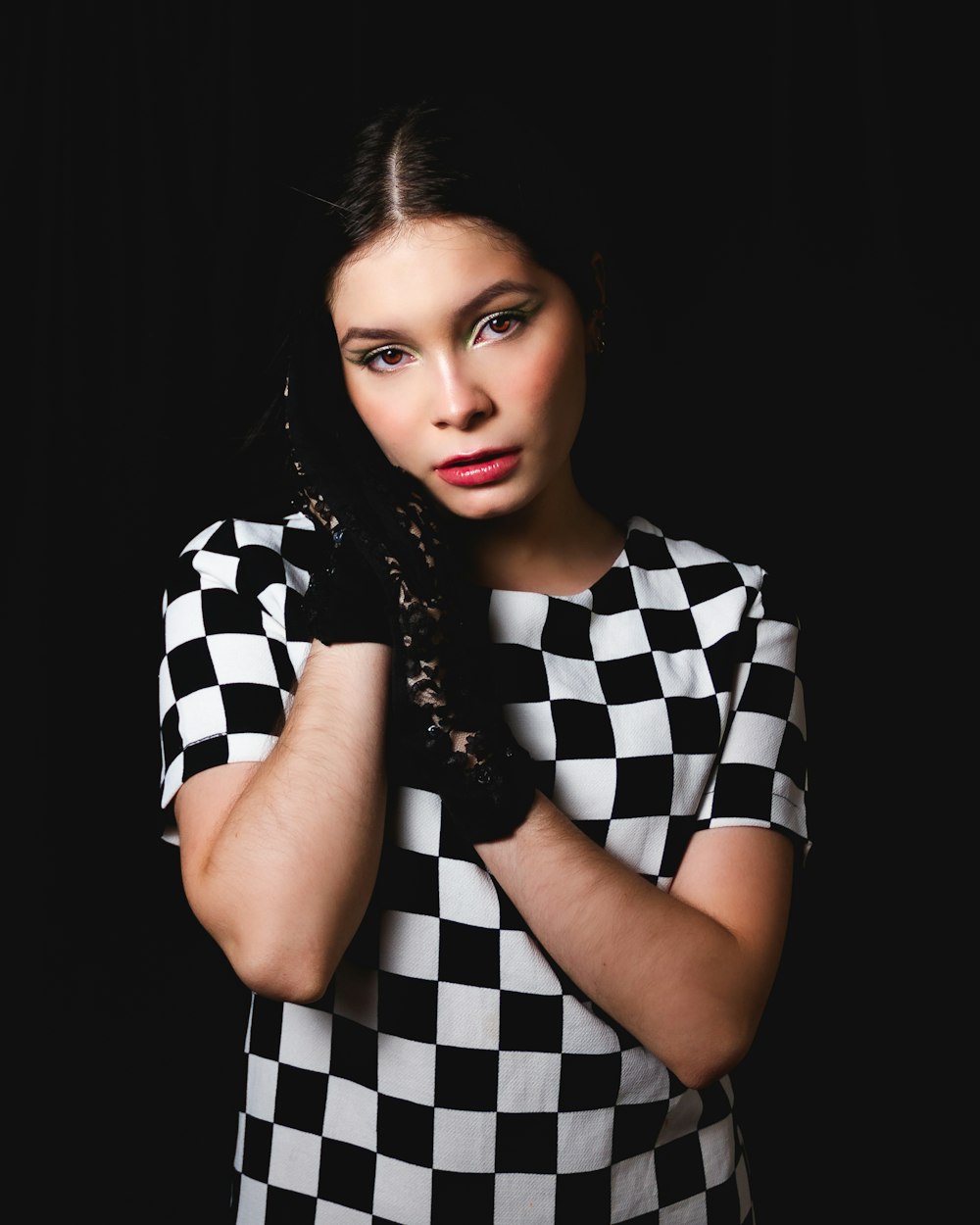 woman in black and white checkered dress