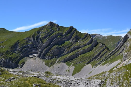 green and brown mountain under blue sky during daytime in Durmitor Montenegro