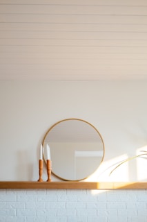 Minimalist wooden mirror with soft ambient lighting in a cozy room