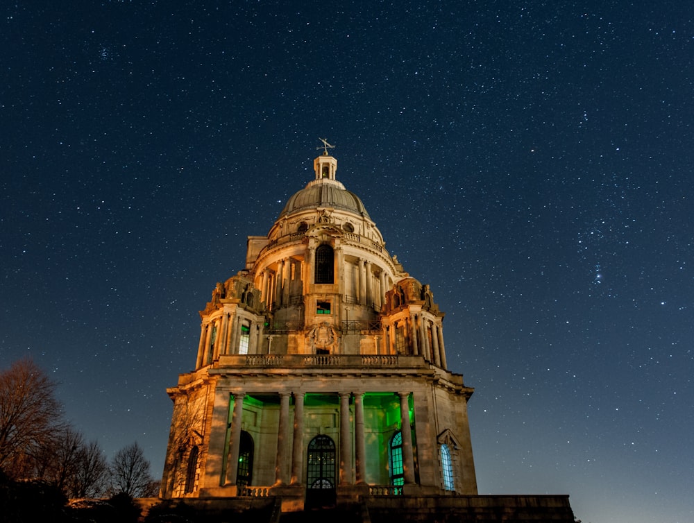 a tower with a clock on it under a night sky