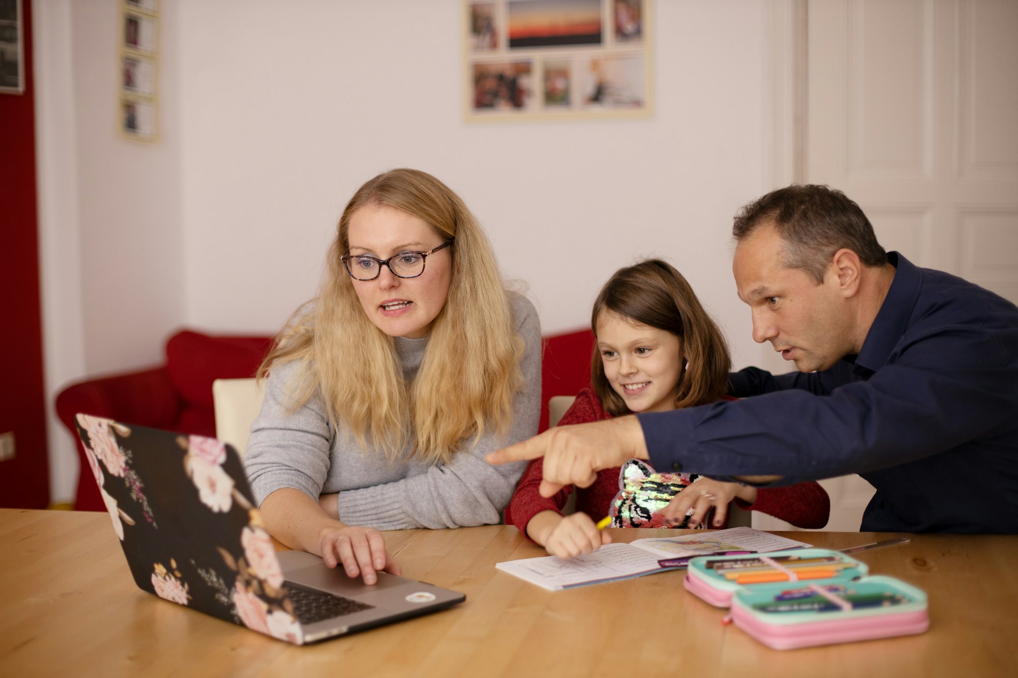 Parents learning teaching their child during homeschooling.