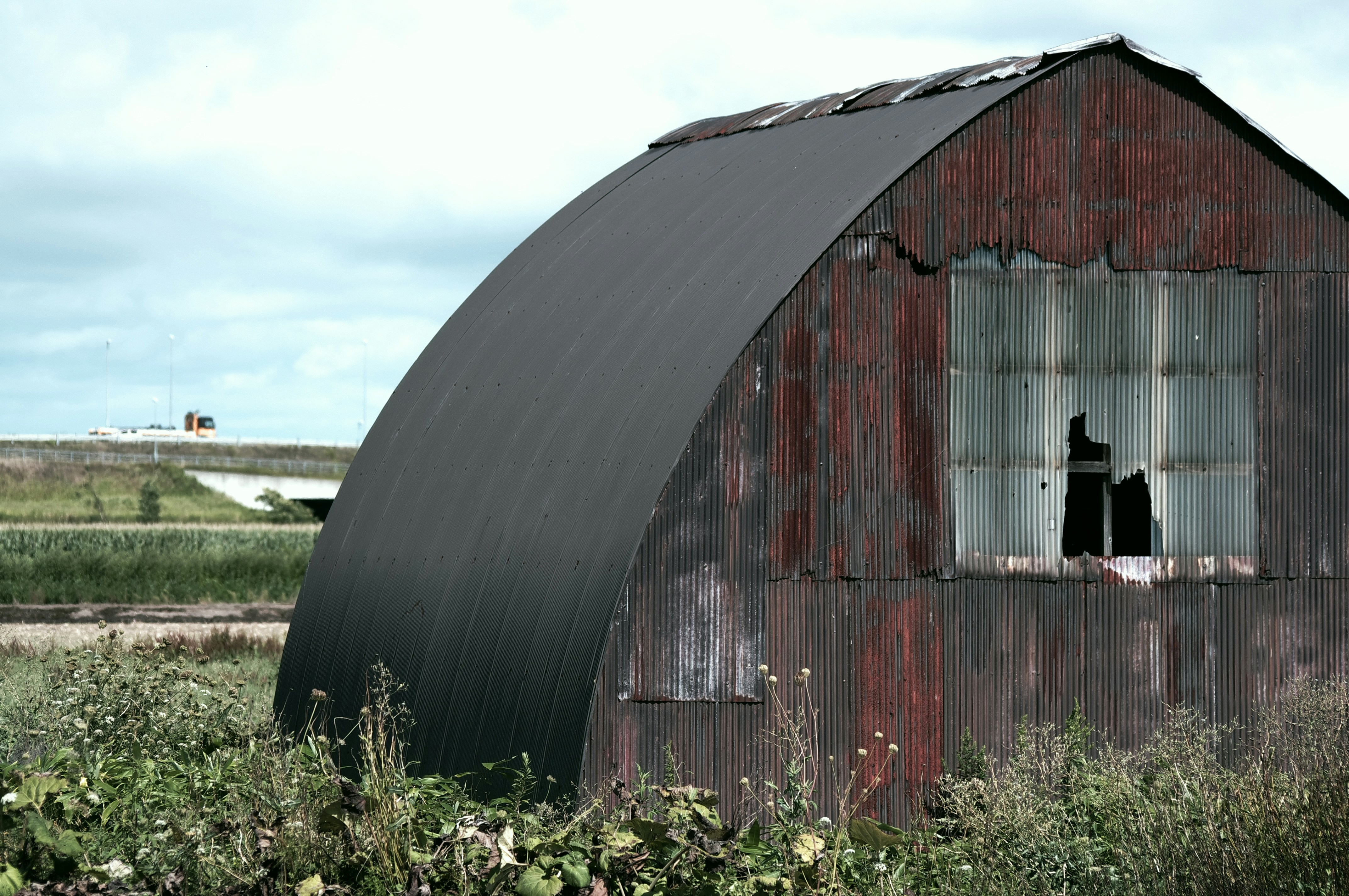 brown wooden barn under blue sky during daytime