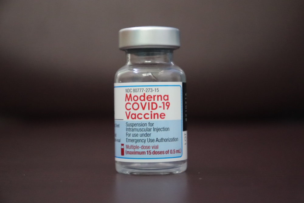 a close up of a bottle of medicine on a table