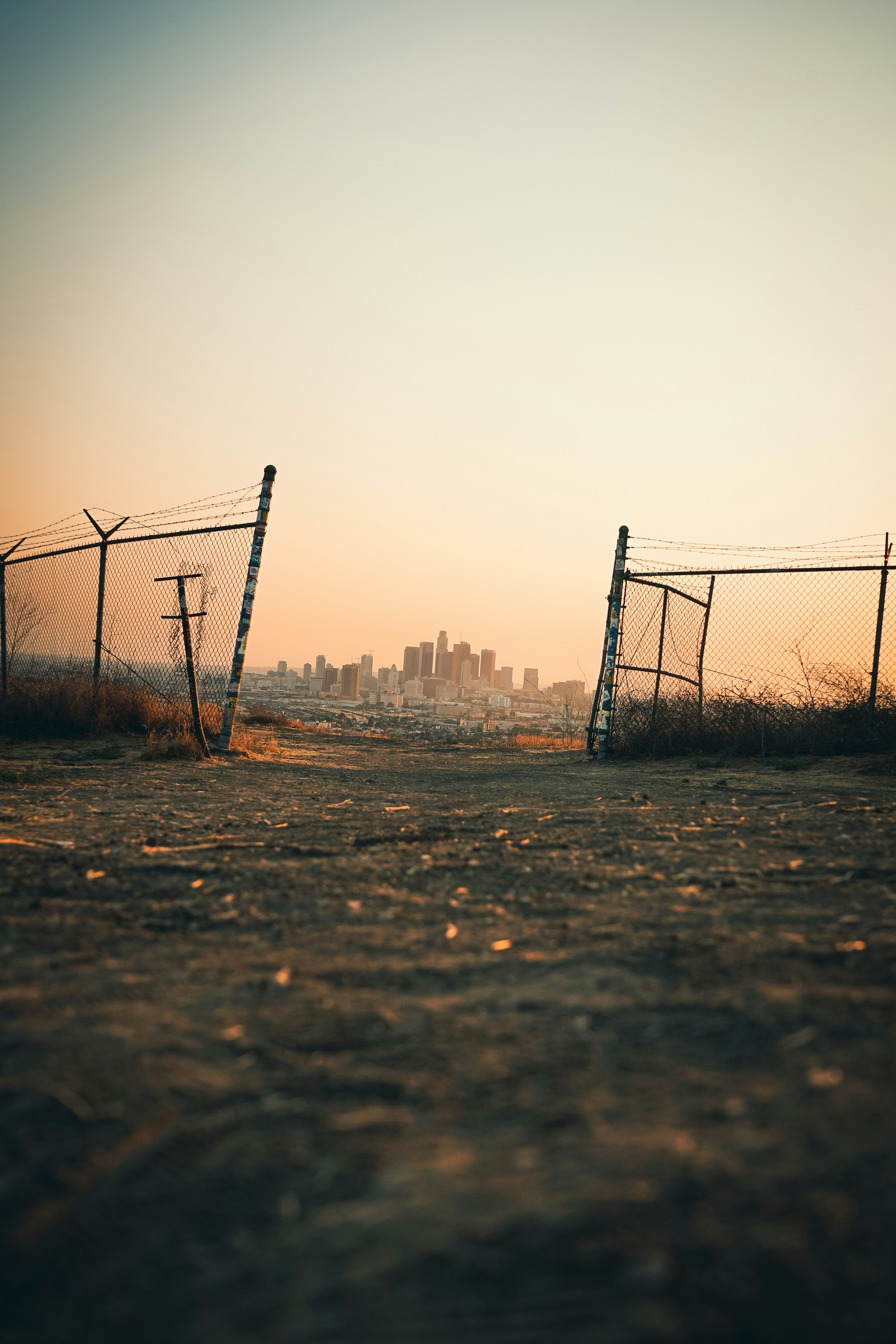 black metal fence on brown field