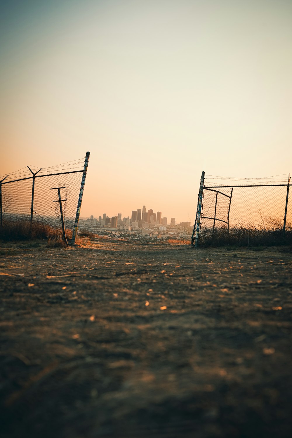 black metal fence on brown field