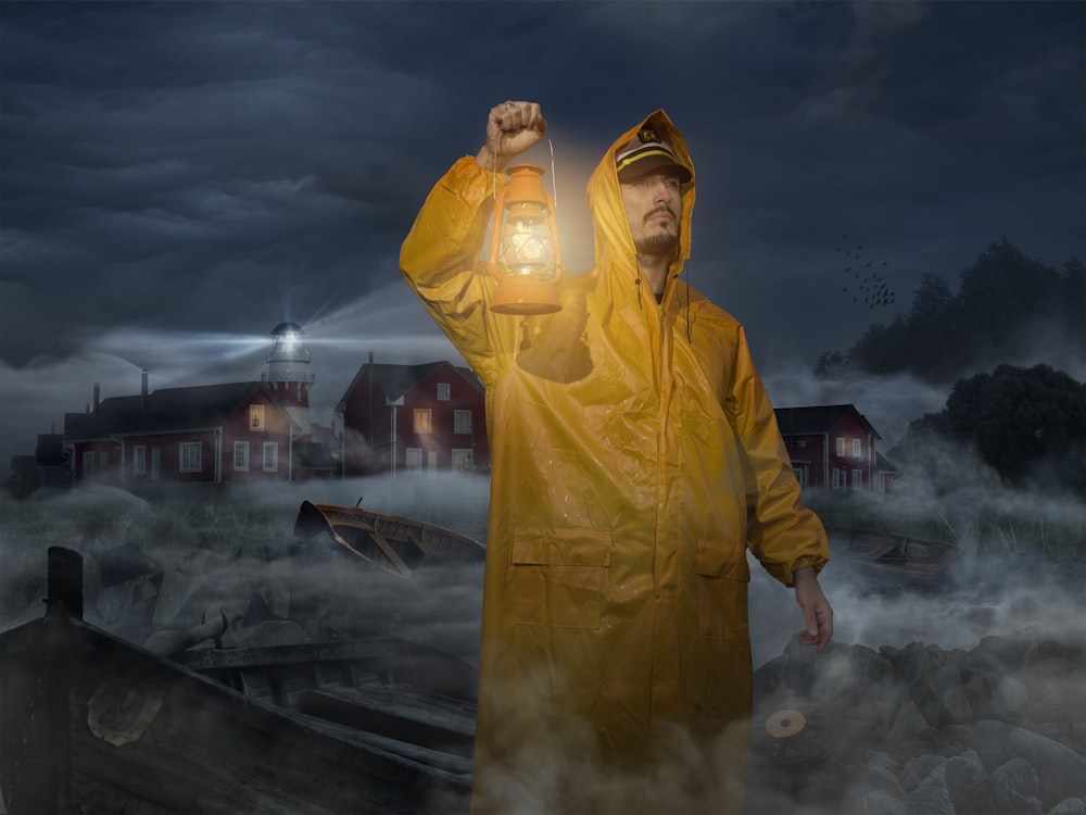 man in yellow jacket standing on road during night time