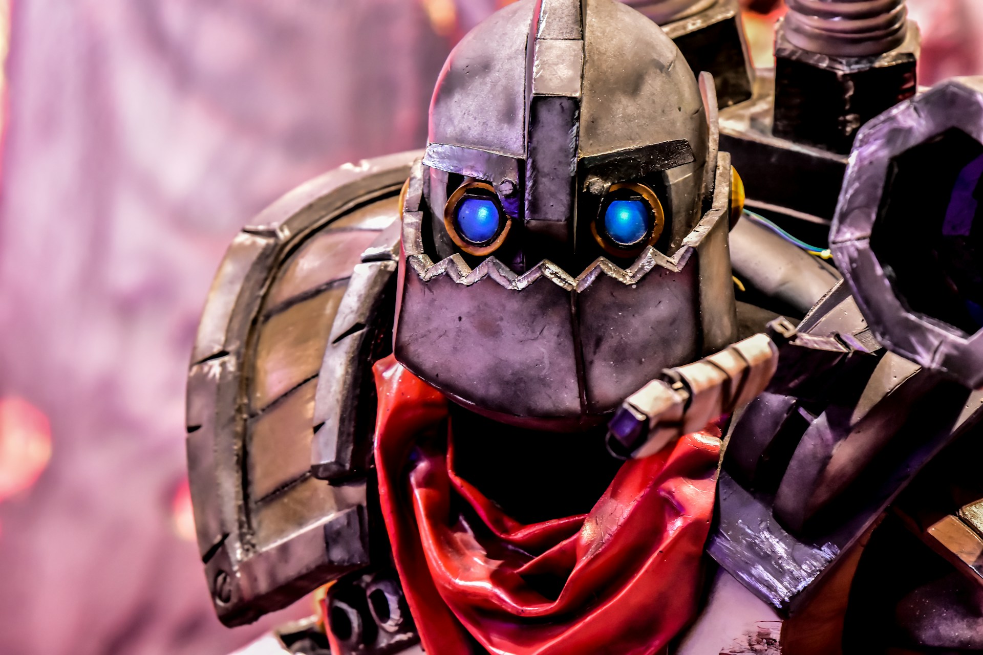 black and red robot in red and black suit