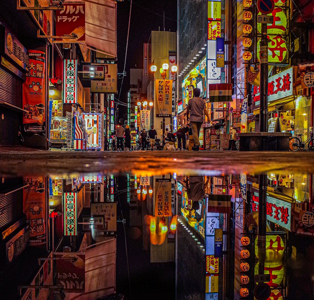 people walking on street during night time