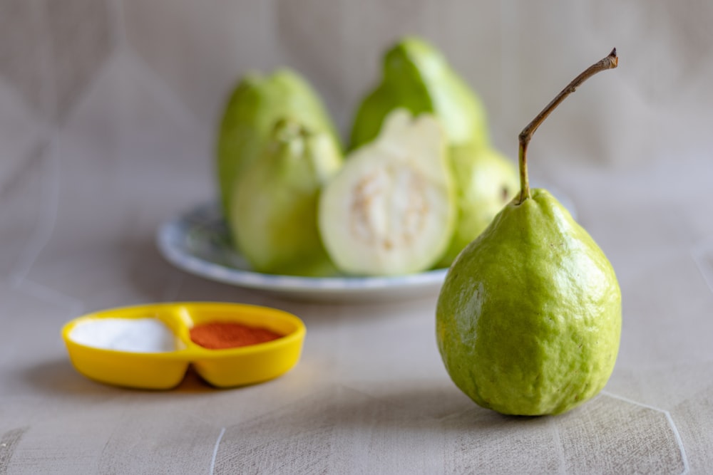 green fruit on white table