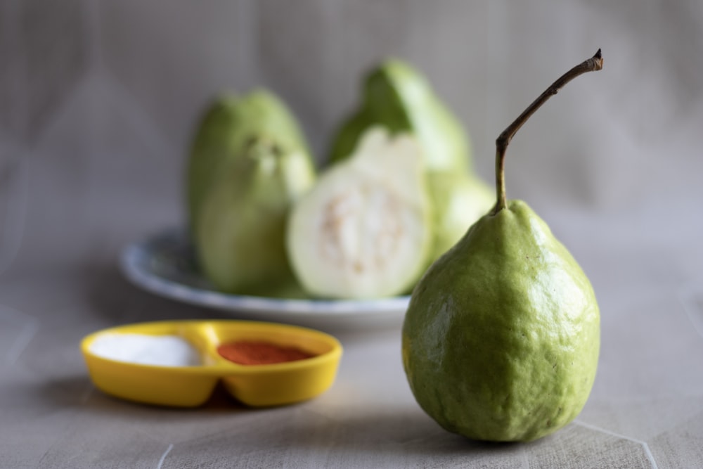 green fruit on white table