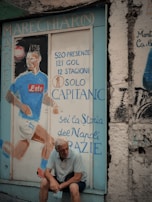 An Serie A jersey displayed with street art in the background.