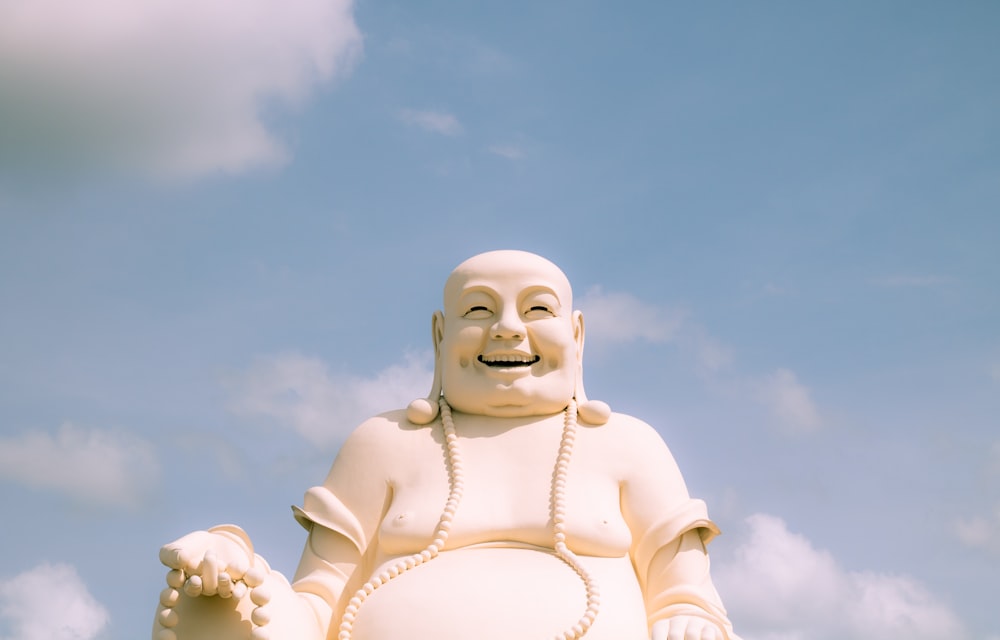 white concrete statue under blue sky during daytime
