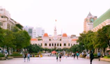 A group of Dominican citizens gathered in a vibrant public square discussing plans