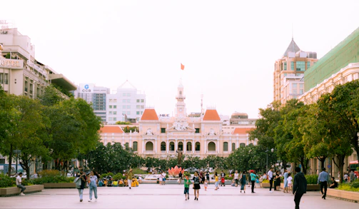 A group of Dominican citizens gathered in a vibrant public square discussing plans