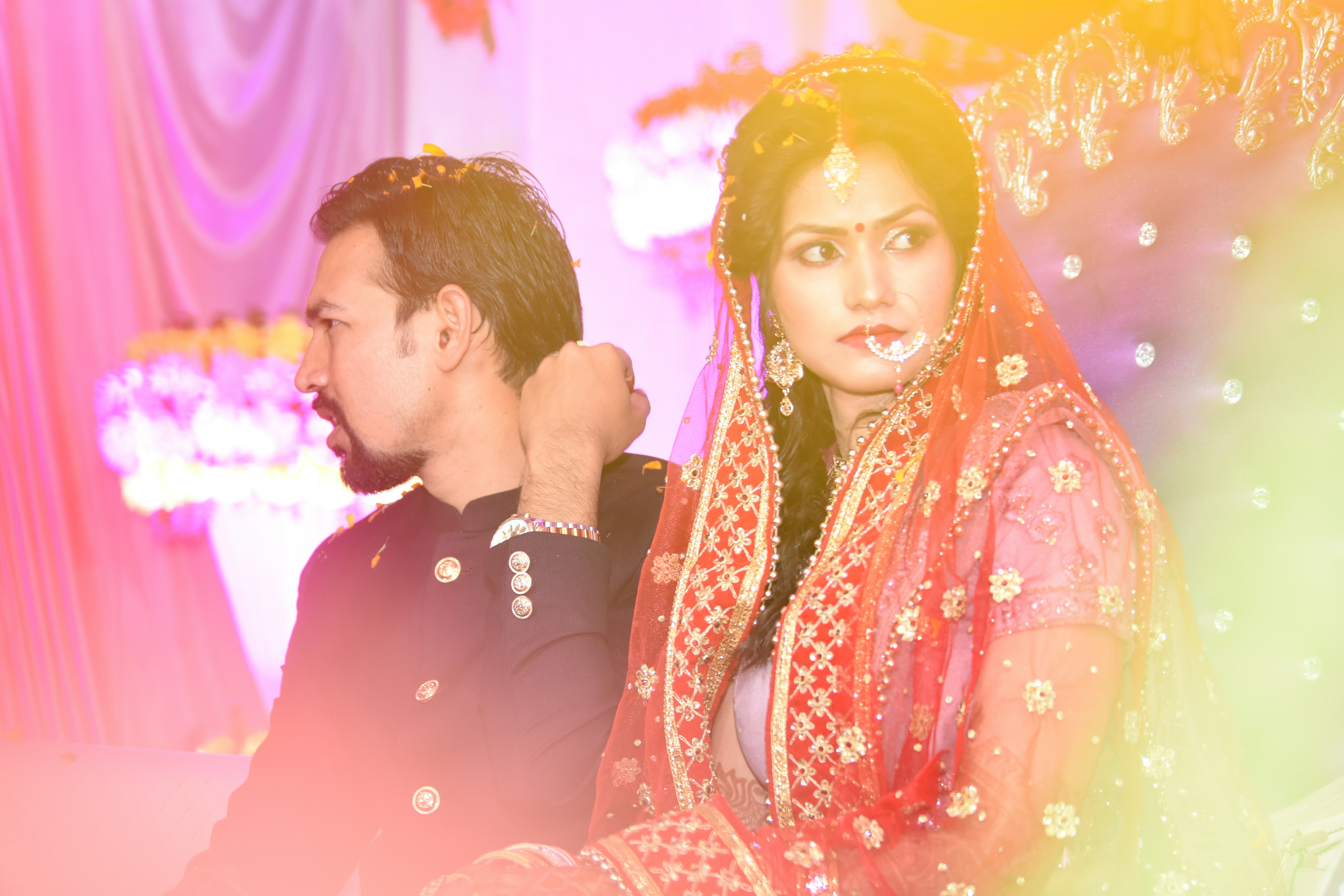 Arjun and Priya Sharma on their wedding day in Jaipur, dressed in traditional Indian wedding attire