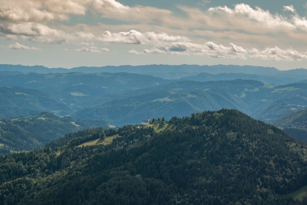 green mountains under white clouds during daytime