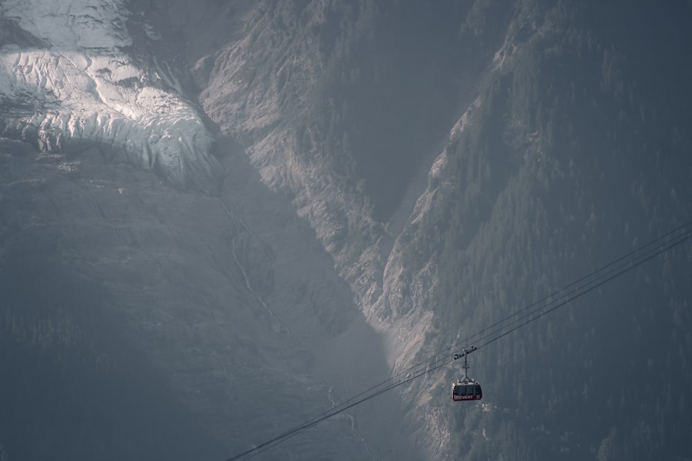 cable car over snow covered mountain