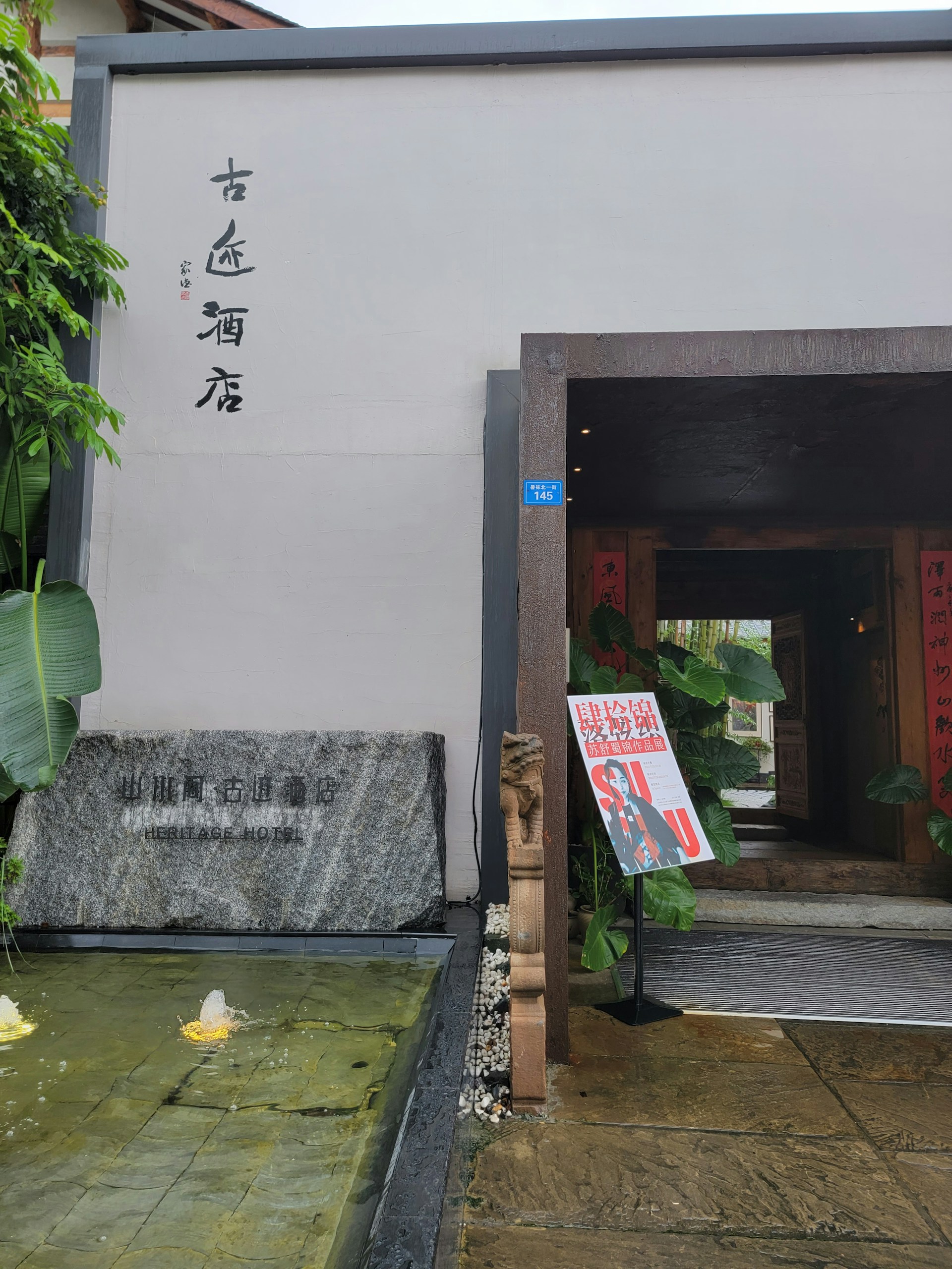 A welcoming school entrance with the alulfah logo and contemporary architectural design.
