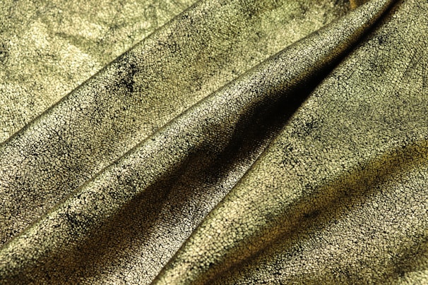 Close-up of luxurious fabric textures in black and rose gold tones