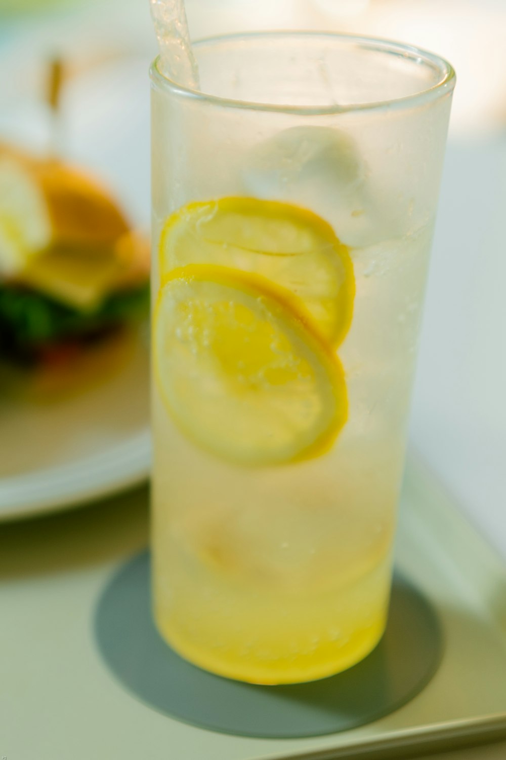 clear drinking glass with yellow liquid