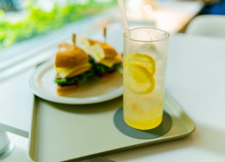 clear drinking glass with yellow liquid