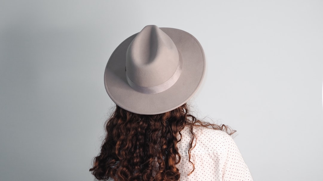 woman in white hat and white shirt