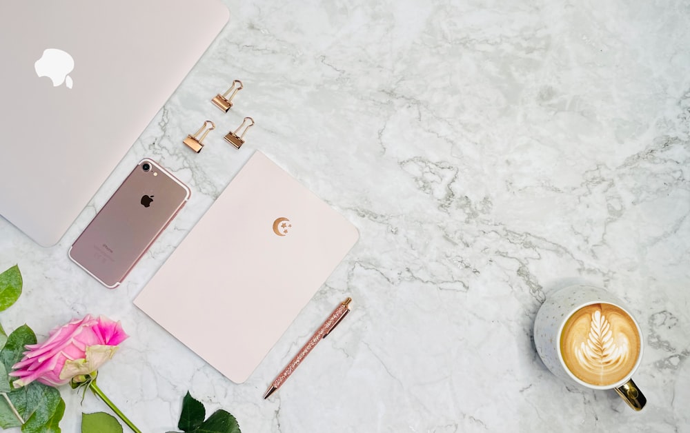 silver iphone 6 on white table