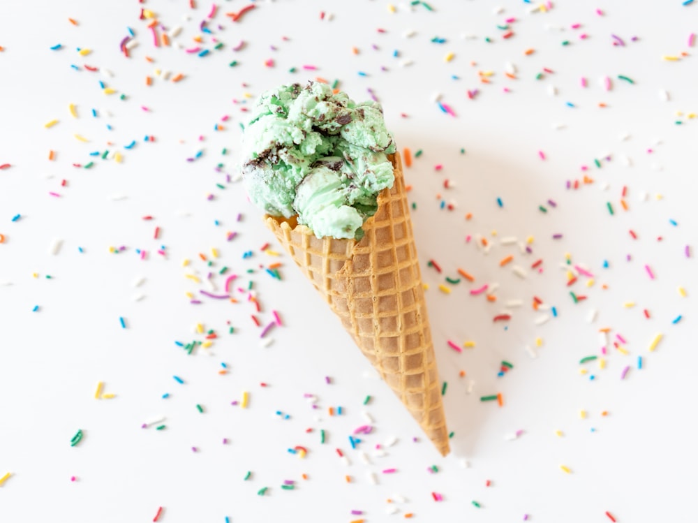 ice cream cone with green powder on top
