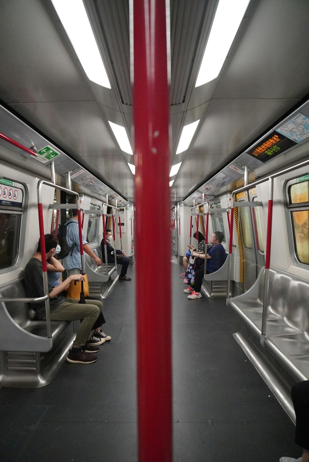 people sitting on train seat