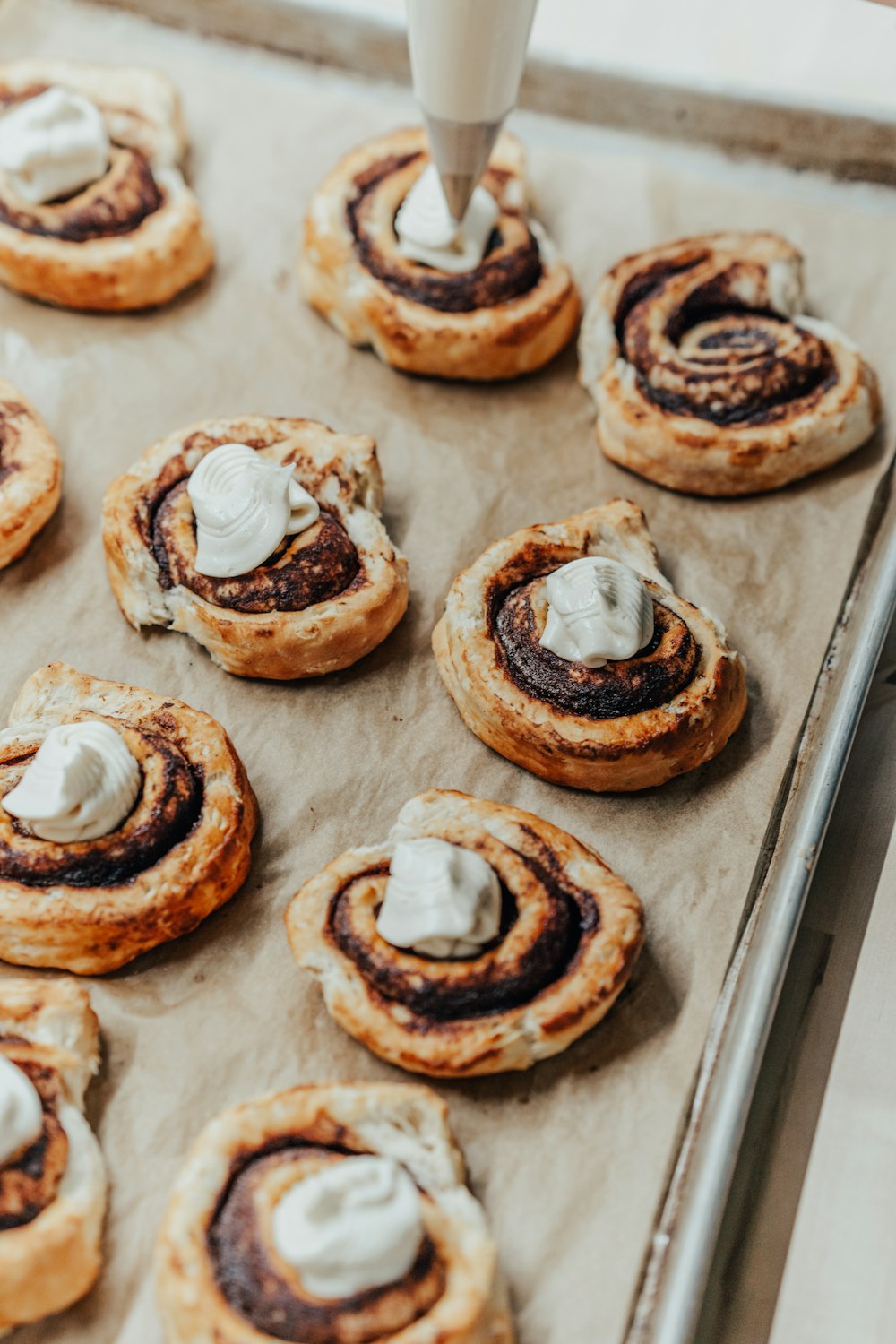 brown and white donuts on brown paper