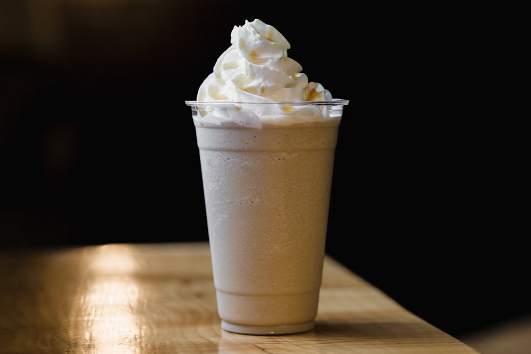 white ice cream in clear plastic cup