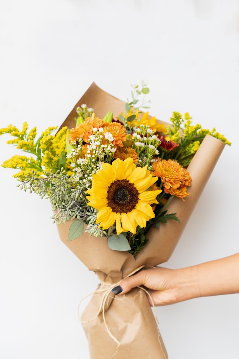 Bright mixed seasonal bouquet wrapped in kraft paper